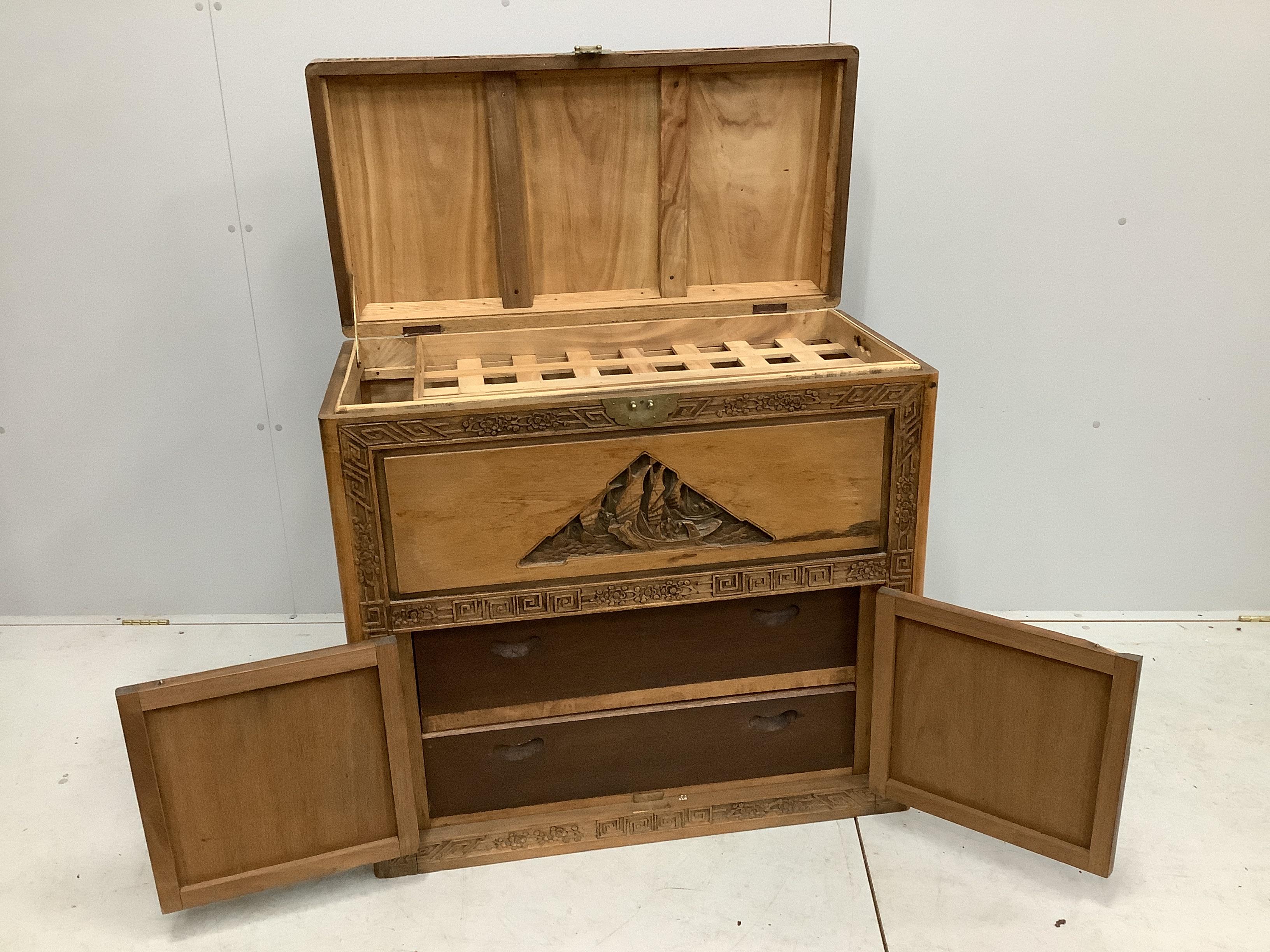 A Cantonese carved camphorwood trunk, width 91cm, depth 45cm, height 86cm